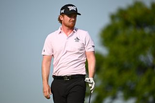 Mason Andersen watches his tee shot