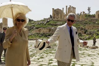 Prince Charles (R) and Camilla, the Duchess of Cornwall, visit the ancient Roman ruins in Jerash