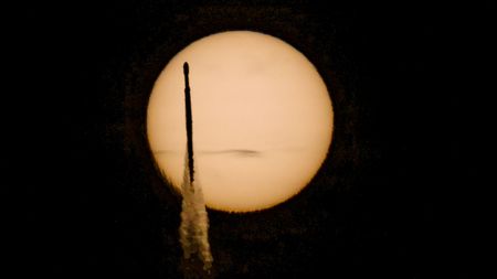 A rocket transits the sun 