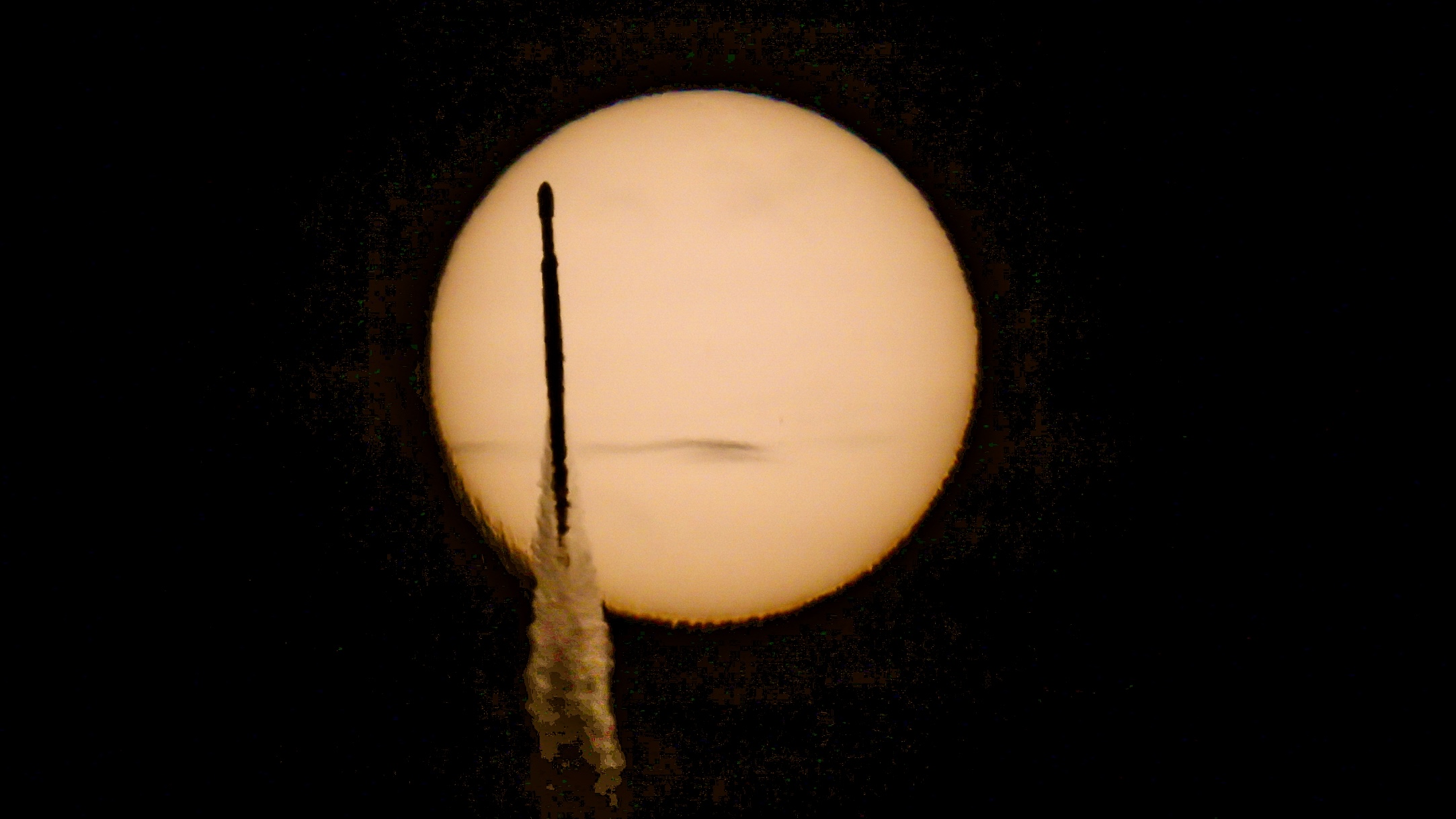 A rocket transits the sun 
