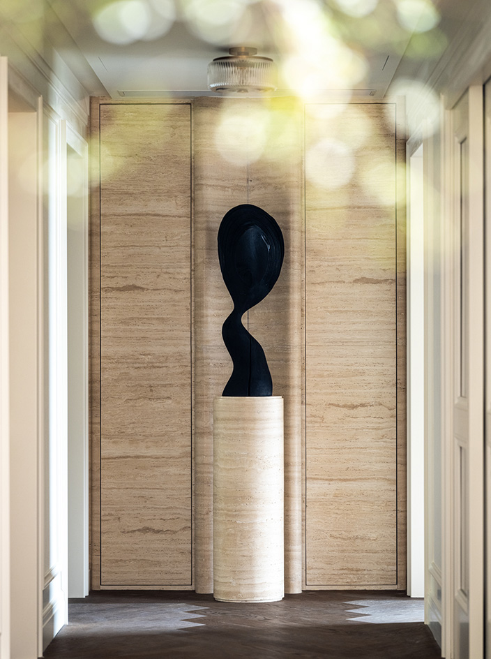 Mountain Residence, the interior of a home composed in light neutral colours and sculptural design and art