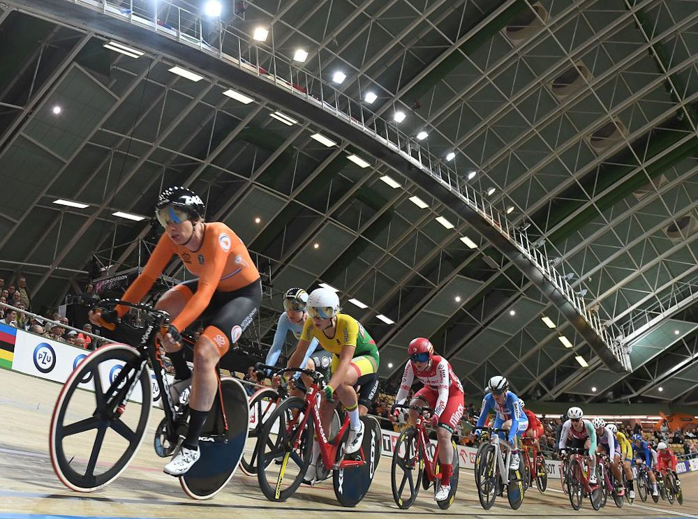 The Netherlands' Kirsten Wild (L) competes during the women' scratch competition of the UCI Track Cycling World Championships