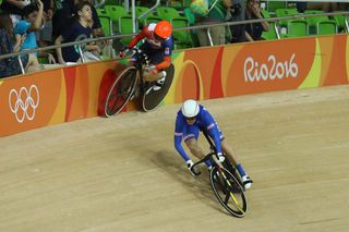 Laurine Van Riessen of the Netherlands avoided crashing by riding on the hoarding
