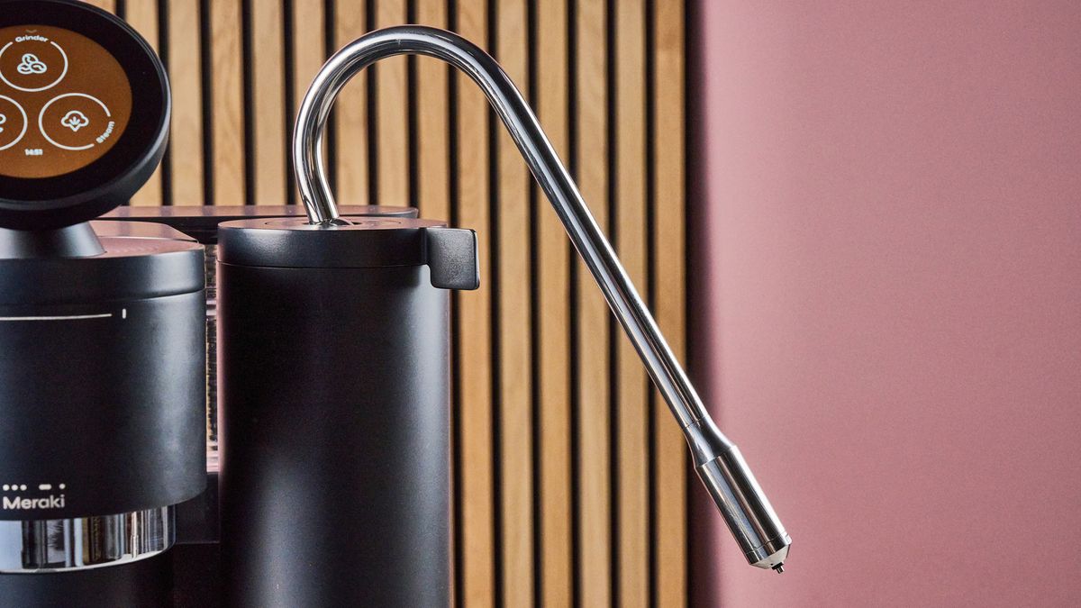 A closeup of the steam wand flexed at a 30 degree angle of the Meraki Espresso Machine.