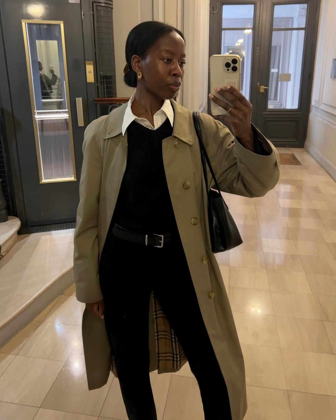 @sylviemus_wearing a white shirt, black jumper and black jeans