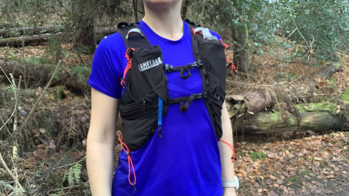 Close up of trail runner wearing the Camelbak Apex Pro running vest