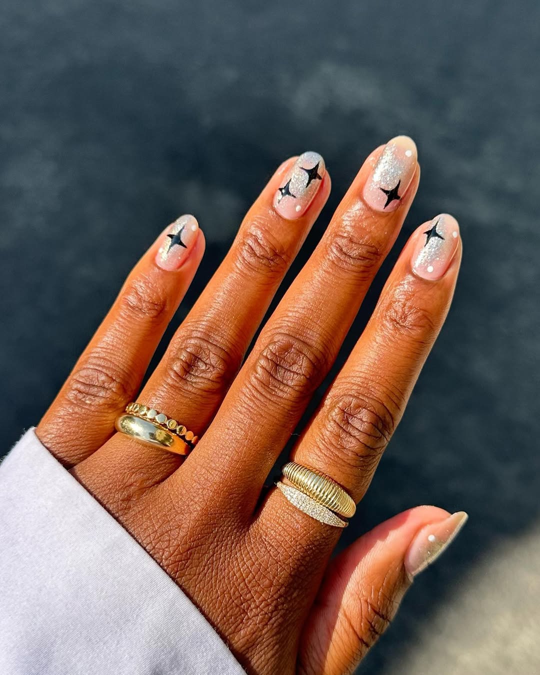 silver nails with black starbursts