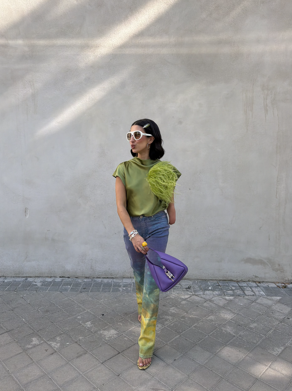 April Lockhart wearing a feathered top