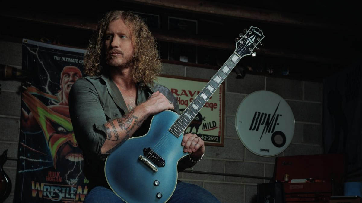 Jared James Nichols sits with his Epiphone signature Les Paul Custom