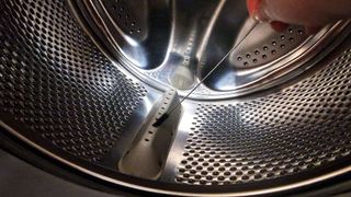 Inside a washing machine being cleaned