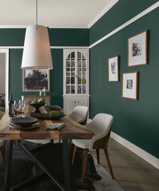 A dark green dining room.