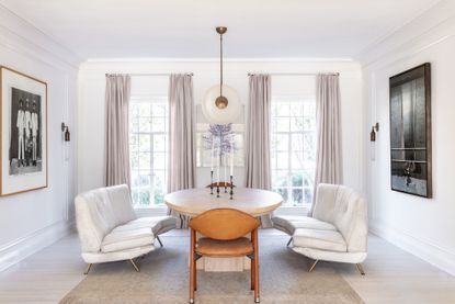 the dining sofa: white dining room with white sofas by Brigette Romanek