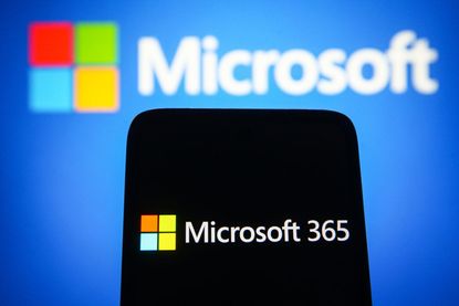 In this photo illustration, a Microsoft 365 logo is seen on a smartphone screen with a Microsoft logo in the background. (Photo Illustration by Pavlo Gonchar/SOPA Images/LightRocket via Getty Images)