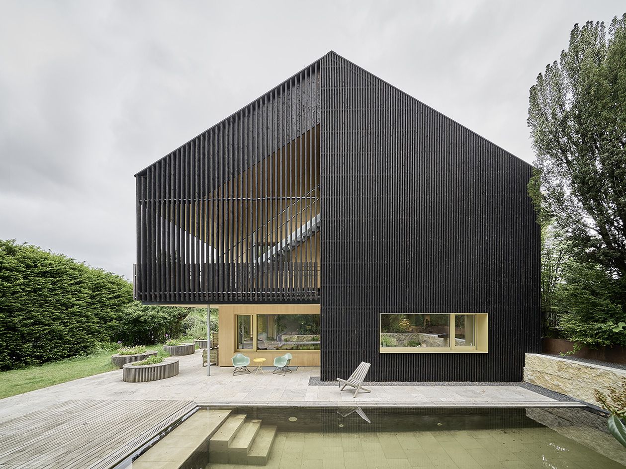 House clad in charred black timber