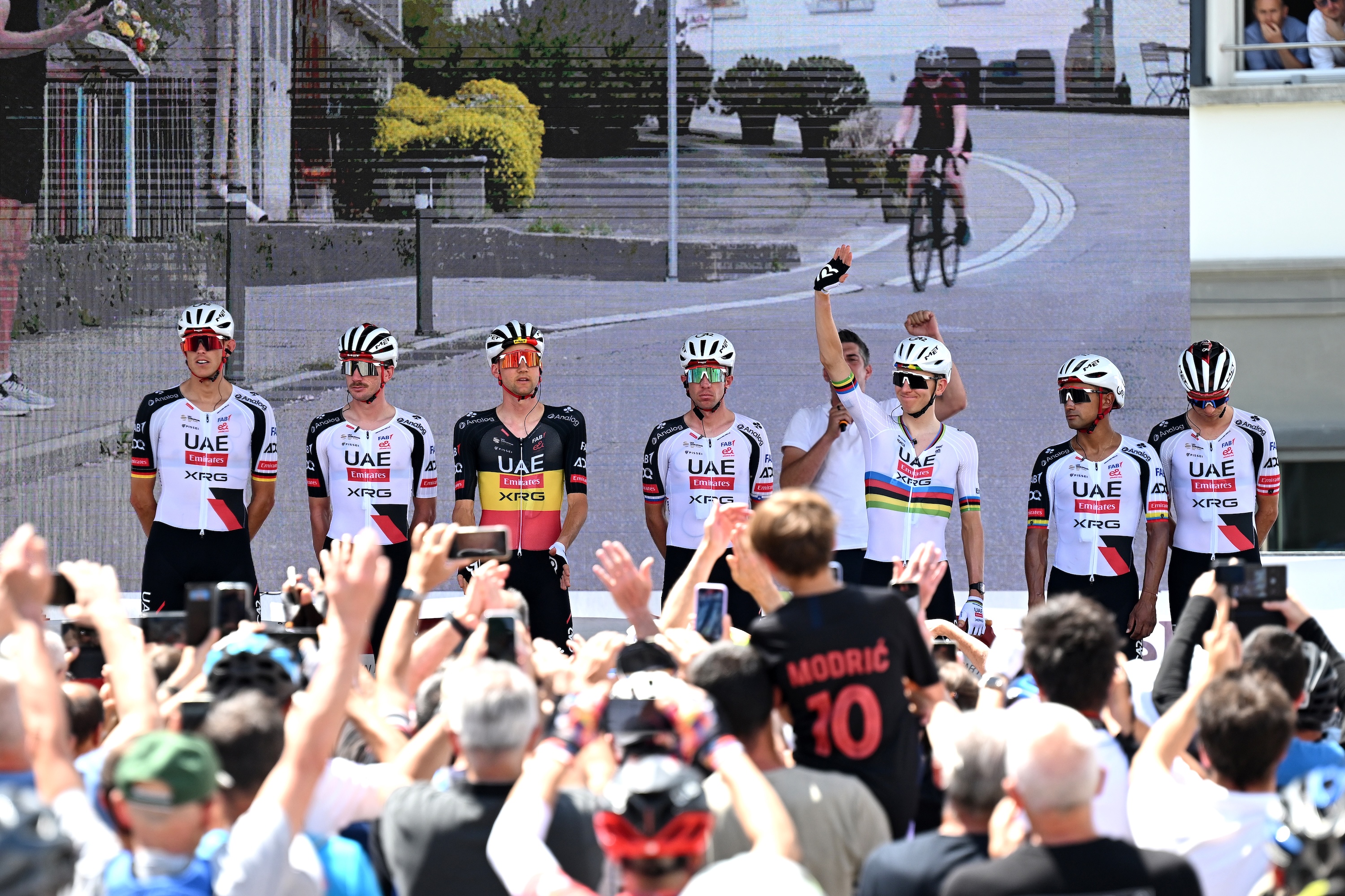 Tadej Pogačar waves as UAE Team Emirates-XRG are presented at the Tour de Suisse