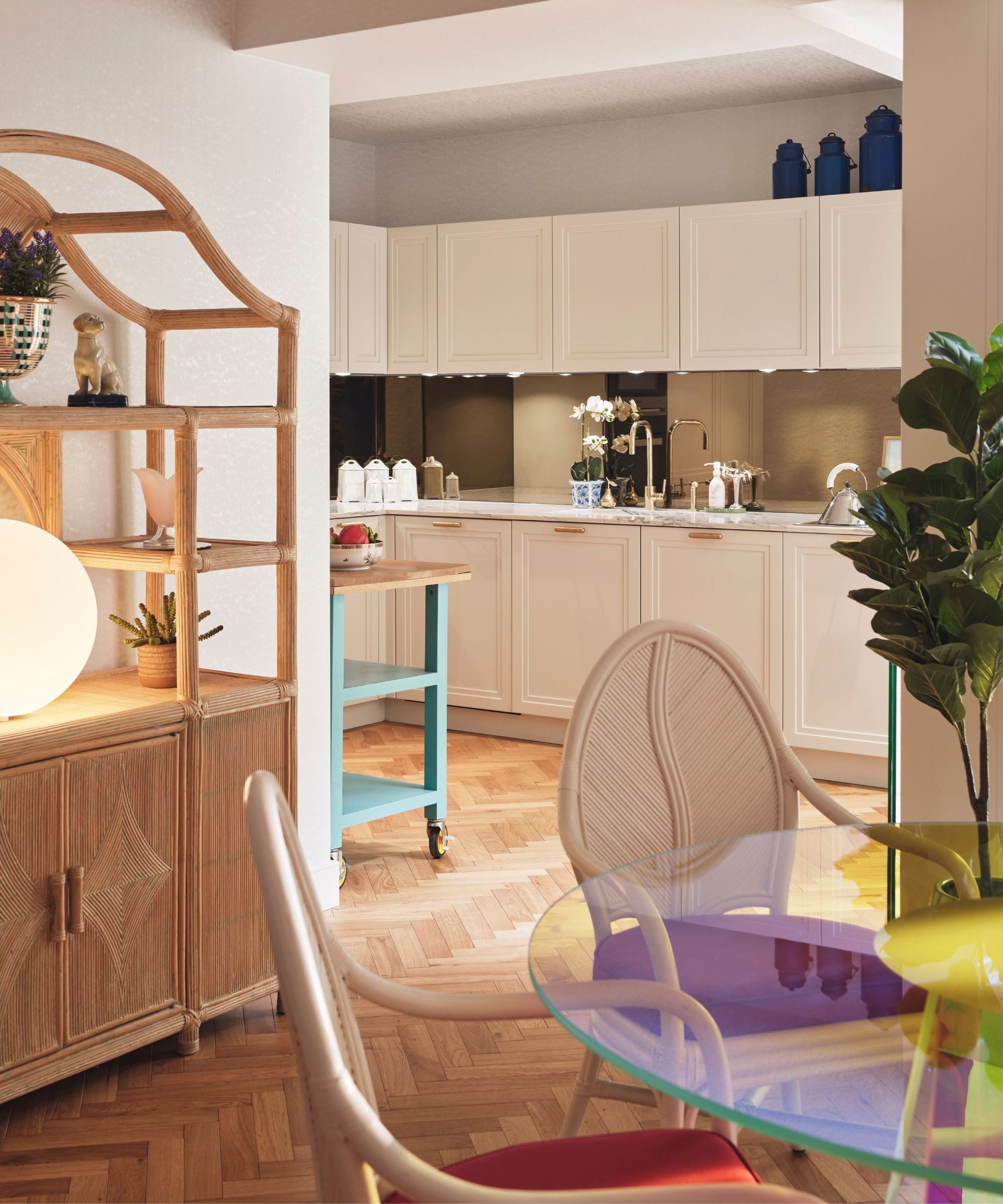 Wooden shelves, round dining table, kitchen cabinets