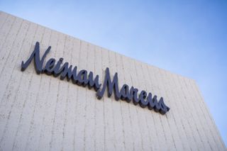 Neiman Marcus sign on a white brick building