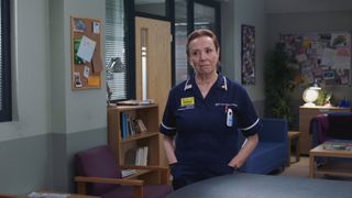 Siobhan in the staffroom, hands in pockets, looking like she's about to lose her temper in a major way - which she is!