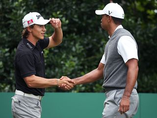 Thorbjorn Olesen shaking hands with Tiger Woods
