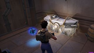 Fortnite - a player looks at an oathbound chest that's all white with gold trim