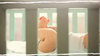 Image of baby legs seen through cot bars