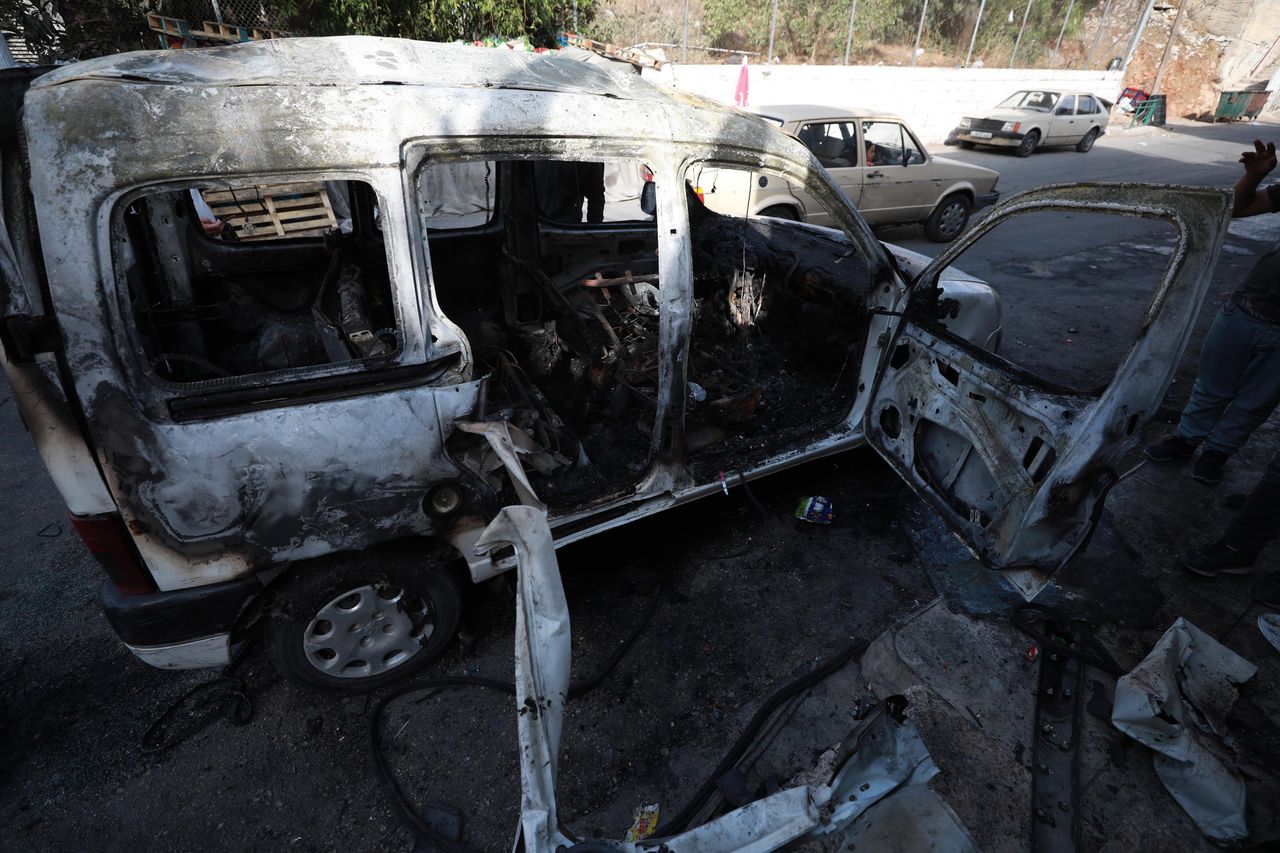 A destroyed van seen after an Israeli raid in the city of Nablus. 