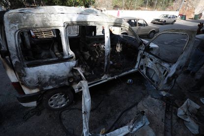 A destroyed van seen after an Israeli raid in the city of Nablus. 