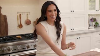 Meghan Markle smiling in With Love, Maghan.