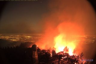 The southern-facing HPWREN live webcam on the Mount Wilson Observatory took this image at 7:51 p.m. PDT on Sept. 17 (0251 GMT on Sept. 18), and it shows activity associated with the Bobcat Fire.