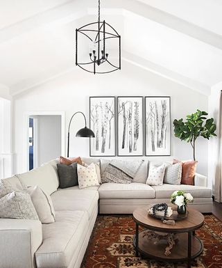 White living room with large grey sofa