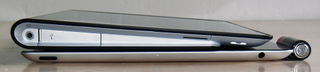 Thickness Compared to AA Battery (right) and iPad 2 (bottom)