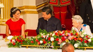 Catherine, Duchess of Cambridge, President of China Xi Jinping (C) and Britain's Queen Elizabeth II attend a state banquet at Buckingham Palace