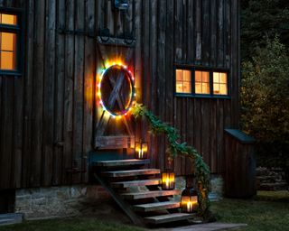 Colourful Christmas front door styling with LED lit large iron wreath