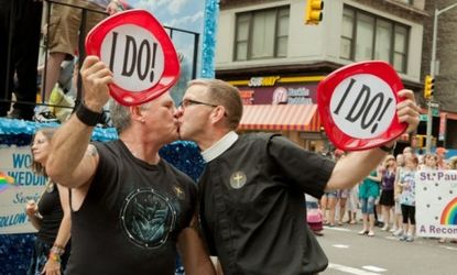 A gay couple celebrates the legalization of same-sex marriage in New York: Such sweeping policy changes can actually improve the health of gay men, according to a new study.