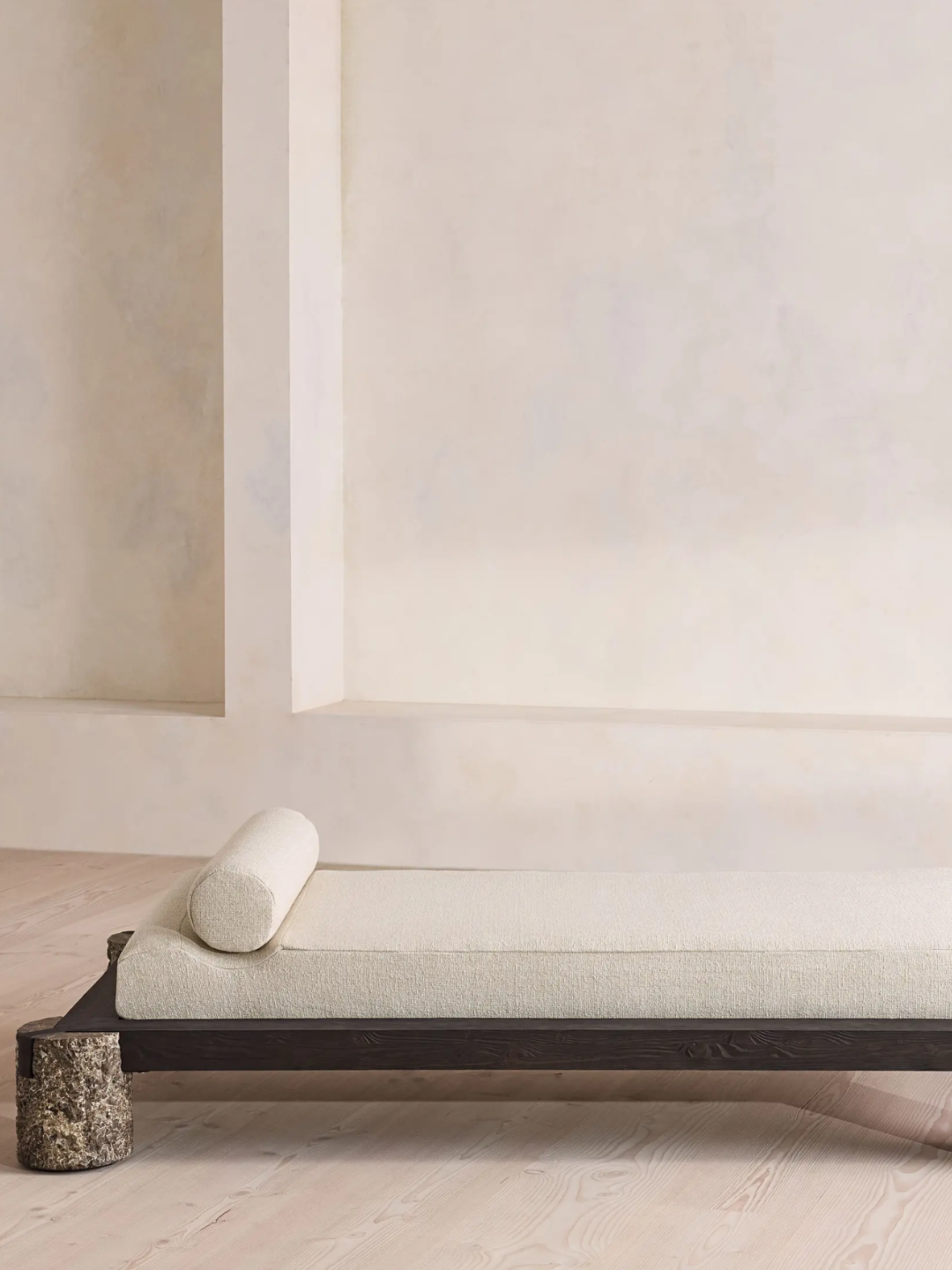 A textured linen daybed with stone feet from Soho Home