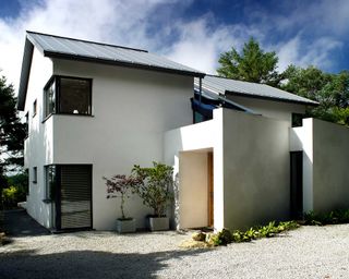gravel driveway by modern house