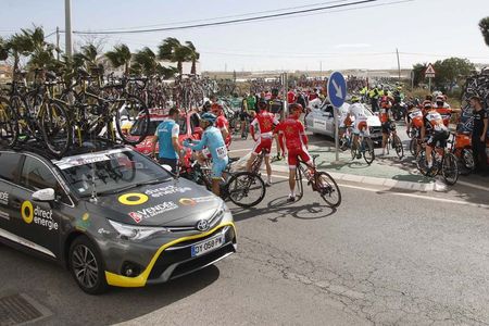 Riders wait after the race is stopped