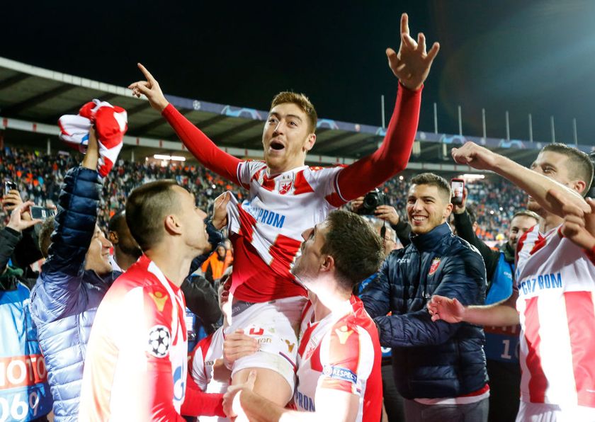 Milan Pavkov is hoisted aloft by Red Star teammates after their victory over Liverpool in 2018