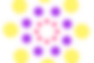 Concentric circles contain yellow, purple and pink circles. The image is blurred and appears to shake slightly