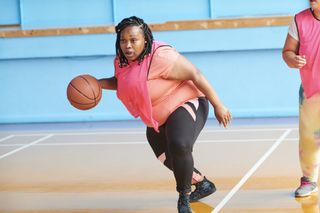 Wellness tips: Woman playing basketball