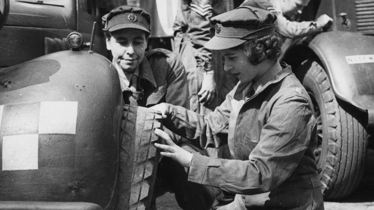 Princess Elizabeth learns to change a vehicle's tyre
