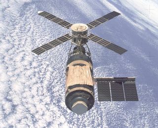 An overhead view of the Skylab Orbital Workshop in Earth orbit as photographed in 1974 from the Skylab 4 Command and Service Modules (CSM) during the final fly-around by the CSM before returning home.