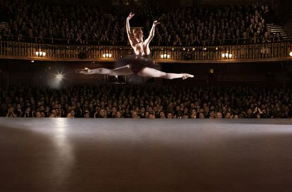 Ballet dancer performing on theater stage
