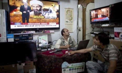 Afghan men watch the news of Osama bin Laden&amp;#039;s death. The al-Qaeda leader&amp;#039;s death is &amp;quot;like a lifting of a curse&amp;quot; for the muslim world, says an Arab News editorial.