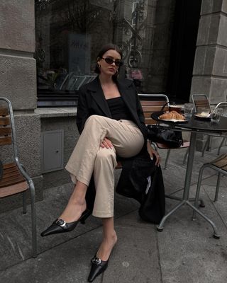 @maryljean wearing pointed toe mules with trousers