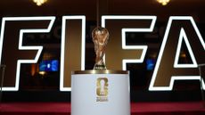 FIFA World Cup 2026 draw – trophy on plinth in front of FIFA logo
