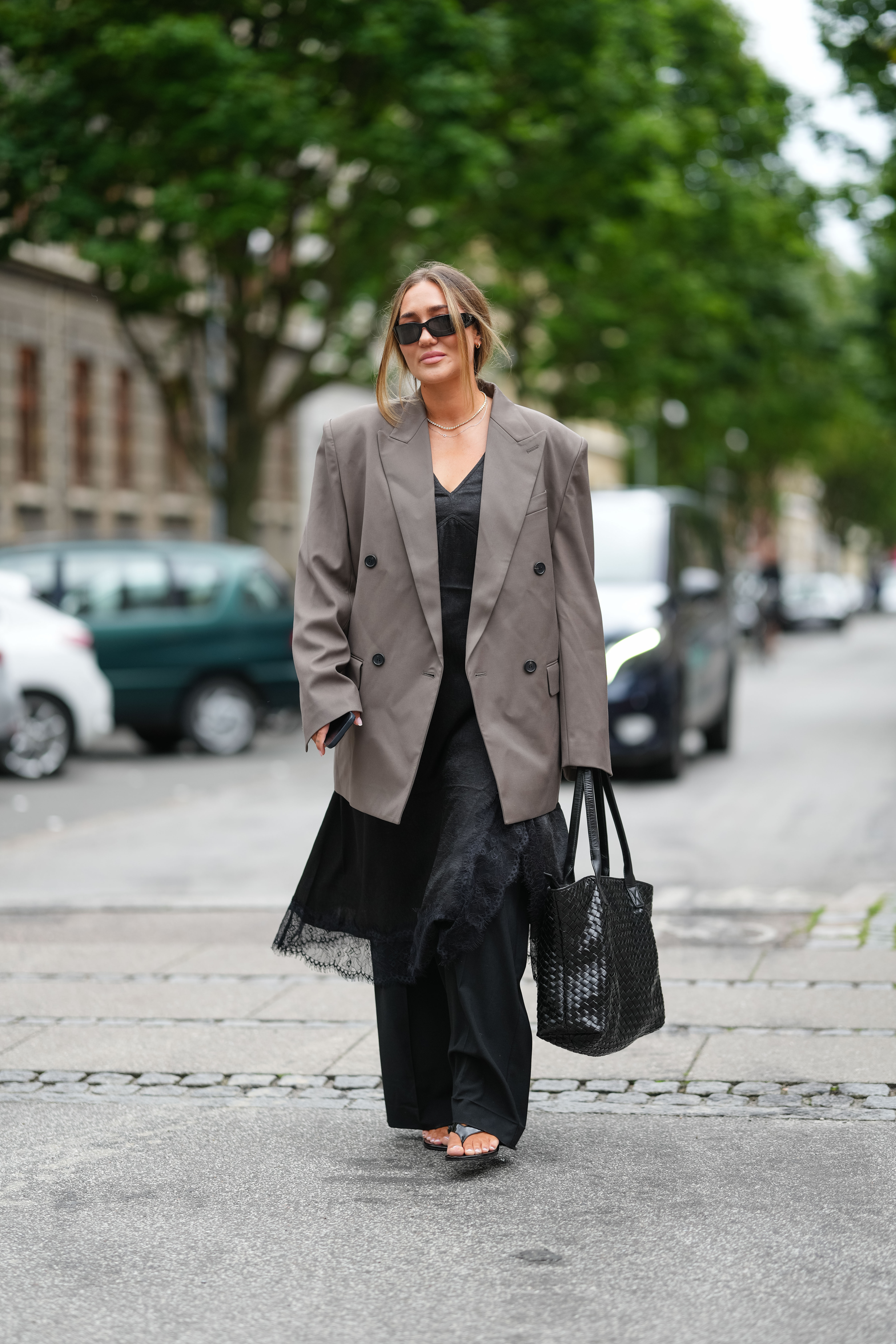 woman wearing blazer, black dress, pants