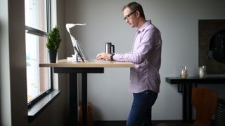 Man Working at a Standing Desk