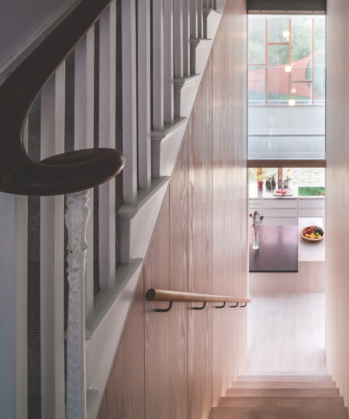 Staircase with kitchen at the bottom