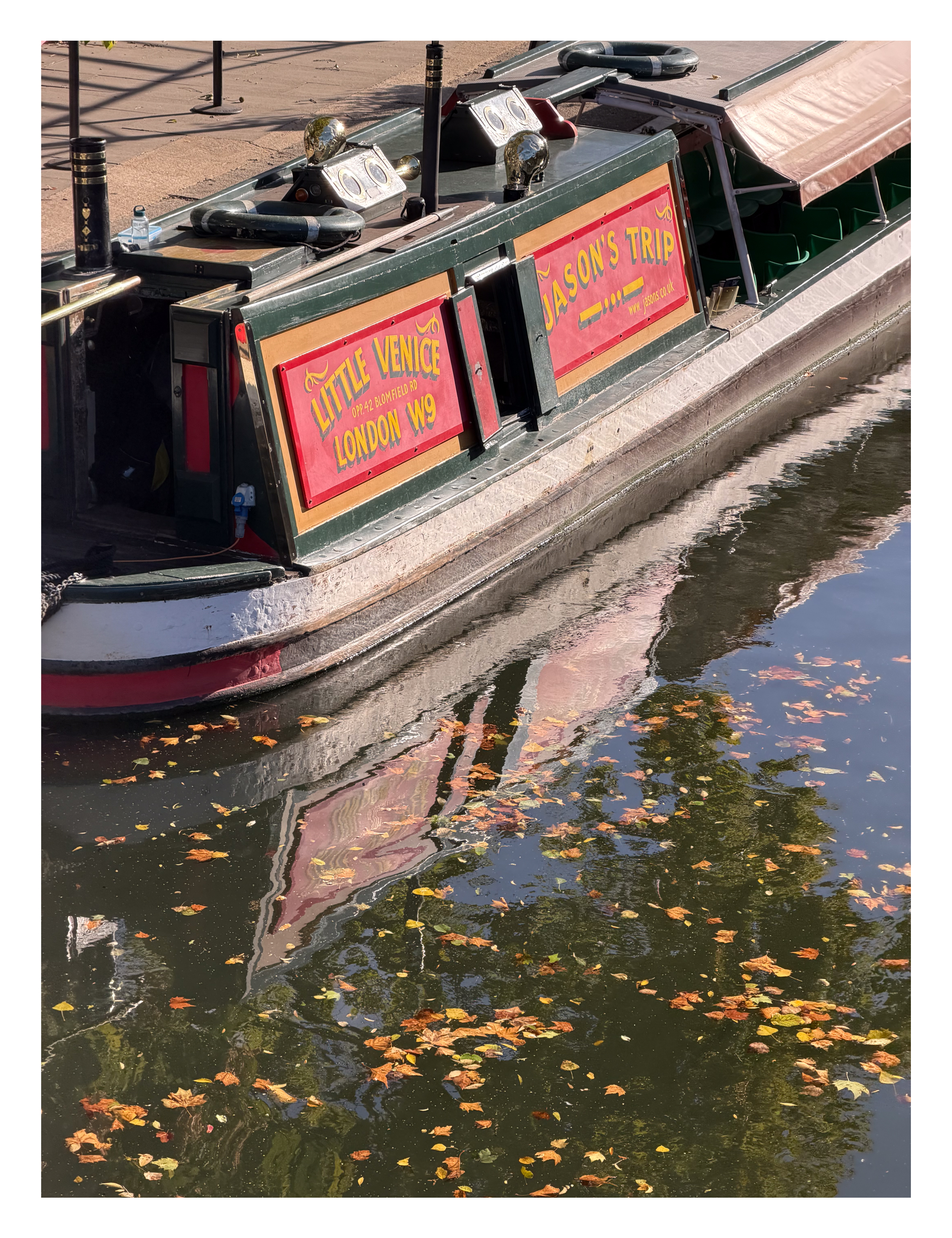 A canal boat on a canal in London